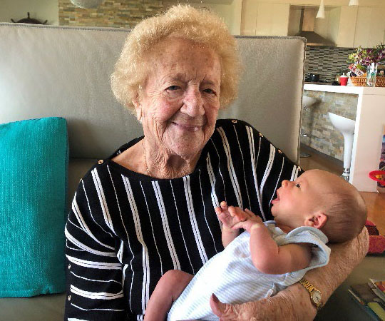 Vera holding her grandson, Max